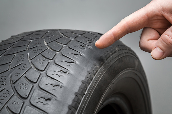 What Causes Tires To Wear Out Faster on One Side? | B&C Auto Center